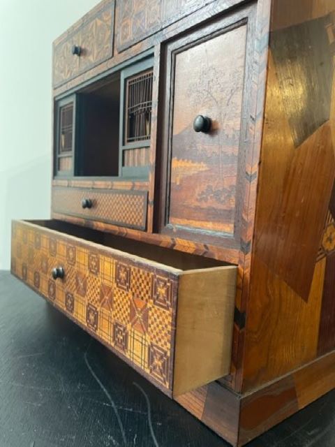 Fine Japanese Tansu with various wood inlays.