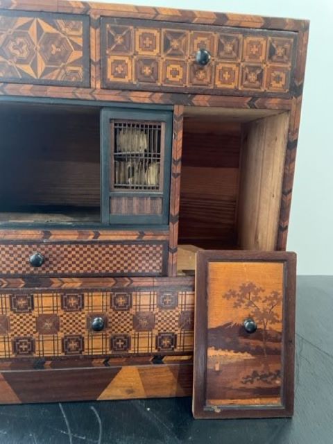 Fine Japanese Tansu with various wood inlays.