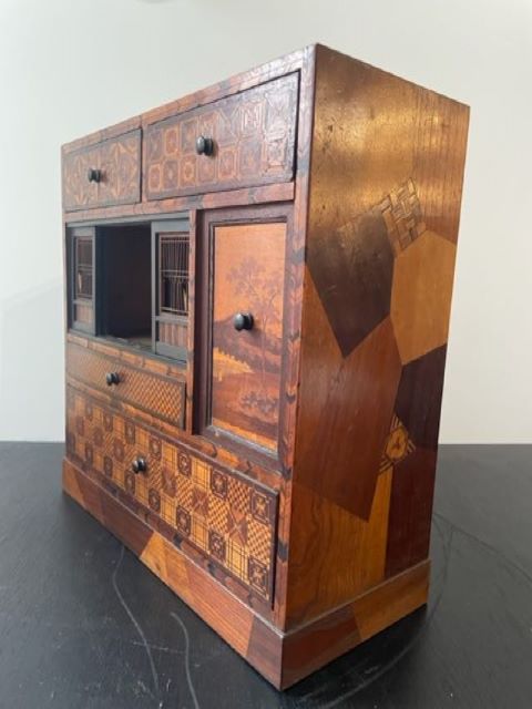 Fine Japanese Tansu with various wood inlays.