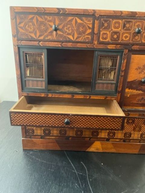 Fine Japanese Tansu with various wood inlays.