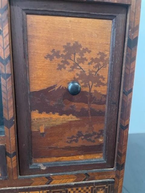 Fine Japanese Tansu with various wood inlays.