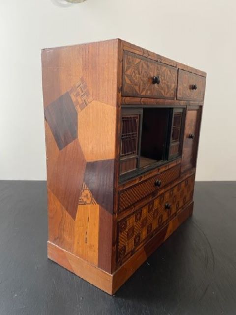 Fine Japanese Tansu with various wood inlays.