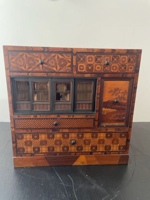 Fine Japanese Tansu with various wood inlays.